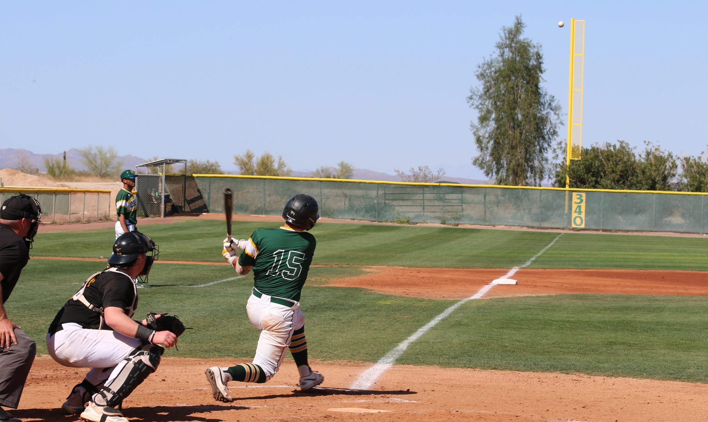 Catcher Trey Newman blasts liner to left but lands foul.