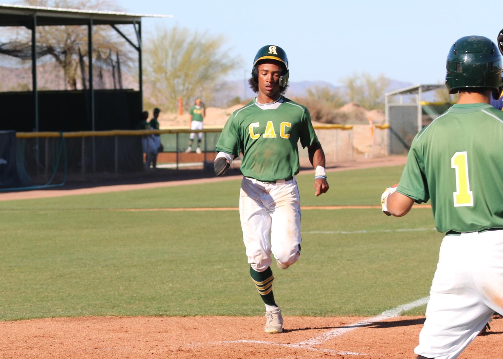 Prince DeBoskie scores one in the sunny days of February. He played center field, scored a few times and tripled during the five game spring break sweep.